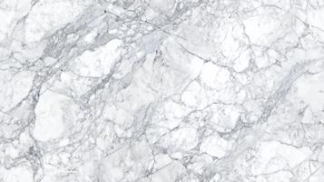 Close-up top view of classic Carrara marble, with soft grey veins running through a white background photo