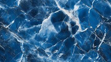 A close-up top view of blue marble with contrasting white and grey veins, adding a cool, serene feel to the design photo