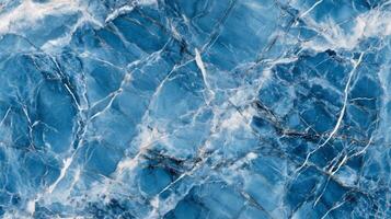A close-up top view of blue marble with contrasting white and grey veins, adding a cool, serene feel to the design photo