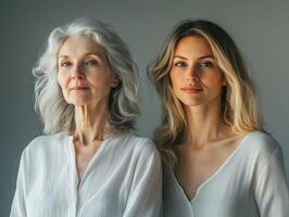 Portrait of two beautiful women, one older and one younger, standing in a relaxed pose, their expressions soft and serene photo