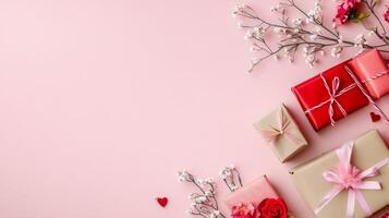 Top view of a romantic Valentine's flat lay with elegant gifts and delicate flowers, centered on a pink background with room for copy space photo