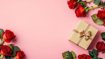 Valentine's Day flat lay with roses and a beautifully wrapped gift box in one corner of the pink background photo
