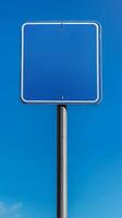Plain blue road sign mounted high on a metal pole, no text, mockup for custom message photo