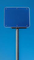 Plain blue road sign mounted high on a metal pole, no text, mockup for custom message photo