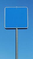 Plain blue road sign mounted high on a metal pole, no text, mockup for custom message photo