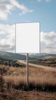 Plain rectangular road sign standing in a rural landscape, blank for custom text photo
