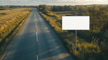 Top view of a blank road sign placed on the side of a rural road, with clear space for text photo