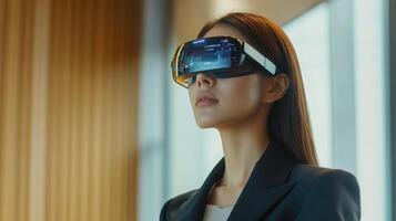 A woman in a business suit using augmented reality glasses during a meeting photo