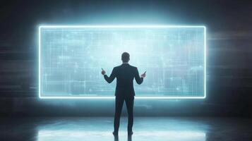 A businessman giving a presentation using a futuristic digital whiteboard photo