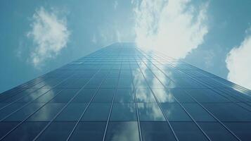 Modern glass skyscraper reflecting the sky, set against an urban backdrop photo