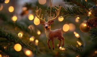 A deer ornament hangs on a Christmas tree photo