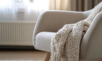 A chair with a white blanket draped over it photo