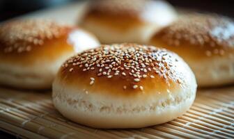 A close up of a sesame seed bun with a brown crust photo