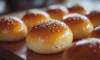 A close up of a dozen sesame seed buns photo
