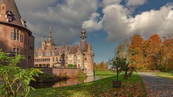 Elegant castle in a public parc, time lapse shot with fluffy clouds and colors of autumn video
