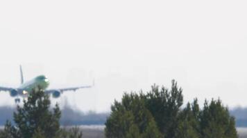 Airplane landing on the runway. Haze on the airfield on a hot day, poor visibility video