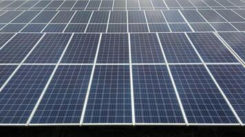 Top view of Solar panels on farm. Alternative source of electricity. solar panels absorb sunlight as a source of energy to generate electricity creating sustainable energy video