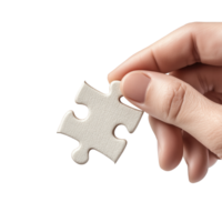 A hand holding a single white puzzle piece against a white isolated background, symbolizing problem-solving, completion, and creativity. png