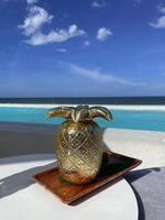 Pineapple juice, a refreshing drink with a sea view. photo