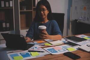 The designer team is designing the uxui system to make the uxui system work well on new phones and support system updates. Website development concept UI UX front end designer photo