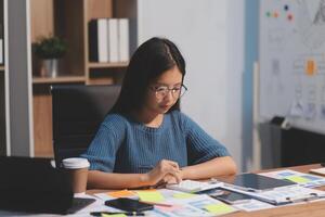 The designer team is designing the uxui system to make the uxui system work well on new phones and support system updates. Website development concept UI UX front end designer photo