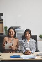 Workers discuss them at the company conference photo