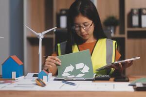 Female architect working at home She looked at the blueprint. photo