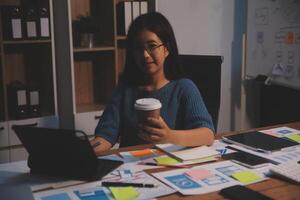 The designer team is designing the uxui system to make the uxui system work well on new phones and support system updates. Website development concept UI UX front end designer photo