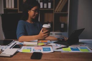 The designer team is designing the uxui system to make the uxui system work well on new phones and support system updates. Website development concept UI UX front end designer photo