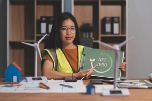 Female architect working at home She looked at the blueprint. photo