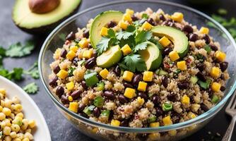 Mexican quinoa salad with black beans, corn, avocado and cilantro photo