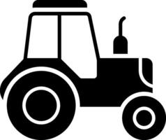 A black and white silhouette of a tractor vector