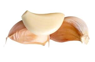 Peeled garlic cloves in stack isolated on white background with clipping path photo