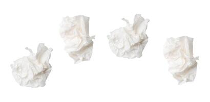 Top view set of screwed or crumpled white tissue paper balls after use isolated on white background with clipping path photo