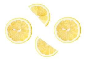 Top view set of fresh ripe yellow lemon fruits in halves and slices or quarters isolated on white background with clipping path photo