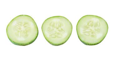 Top view set of fresh green cucumber slices in circle shape isolated on white background with clipping path photo