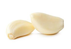 Side view of peeled garlic cloves in stack isolated on white background with clipping path photo