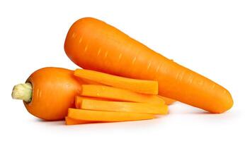 Side view of orange carrot roots with slices in stick shape in stack isolated on white background with clipping path photo