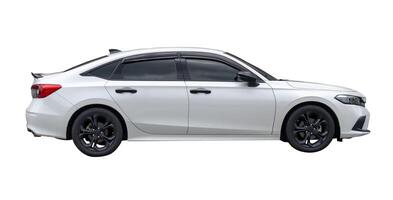 Side view of white sedan car isolated on white background with clipping path photo