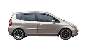 Side view of gray or grey hatchback car isolated on white background with clipping path photo