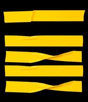 Top view set of wrinkled or crumpled yellow adhesive vinyl tape or cloth tape in stripes shape isolated on black background with clipping path photo