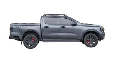 Side view of dark gray or black pickup truck isolated on white background with clipping path photo