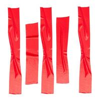 Top view set of wrinkled red adhesive vinyl tape or cloth tape in stripe shape isolated on white background with clipping path photo