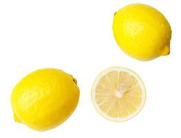 Top view set of two fresh ripe yellow lemon fruits with half or slice isolated on white background photo