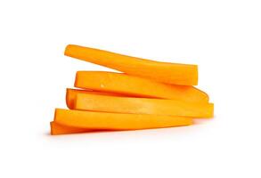 Side view of orange carrot slices in stick shape in stack isolated on white background with clipping path photo