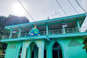 View of the colorful mosque on a bright morning against the blue sky photo