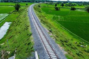 View of railway tracks in rural Indonesia in the afternoon photo