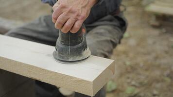 Close up of sanding wooden board with sander to get smooth surface video