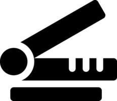 A black and white icon of a stapler vector