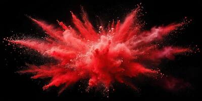 Red powder exploding in high angle view on black background, creating red clouds photo